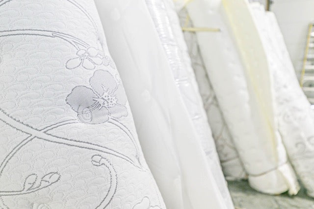 rolls of mattress covers lined up on a wall Winndom Mattress covers, foam mattress covers, innerspring mattress covers