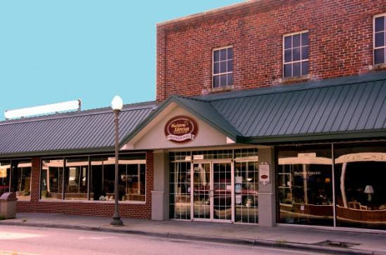 Storefront with a brick building and glass windows on a clear day Blackstone Emporium